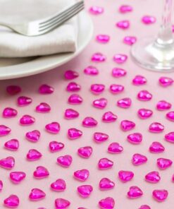 Pose med pynte diamanter formet som små pink hjerter – dekorativ bordpynt til fest og events.