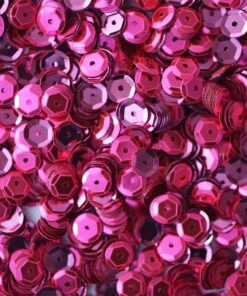 Pink pailletter 6 mm, 500 stk., skinnende runde palietter spredt foran en skål.