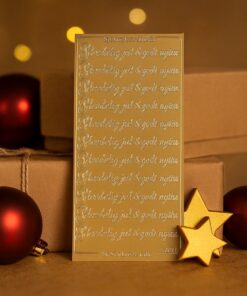 Guld stickers med teksten “Glædelig jul & godt nytår” på et ark fra Starform.