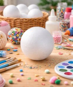 Styroporkugle 6 cm til kreativ hobby omgivet af DIY materialer som maling, perler og pensler