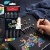 Faber-Castell Black Edition farveblyanter i brug på sort papir med synlig emballage og intense farver