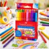 Faber-Castell Grip tusser 20 stk i brug hvor et barn tegner med farverige ergonomiske tusser