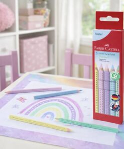 Faber-Castell Jumbo Grip pastel farveblyanter i brug på børnebord med regnbuetegning og produktæske i baggrunden