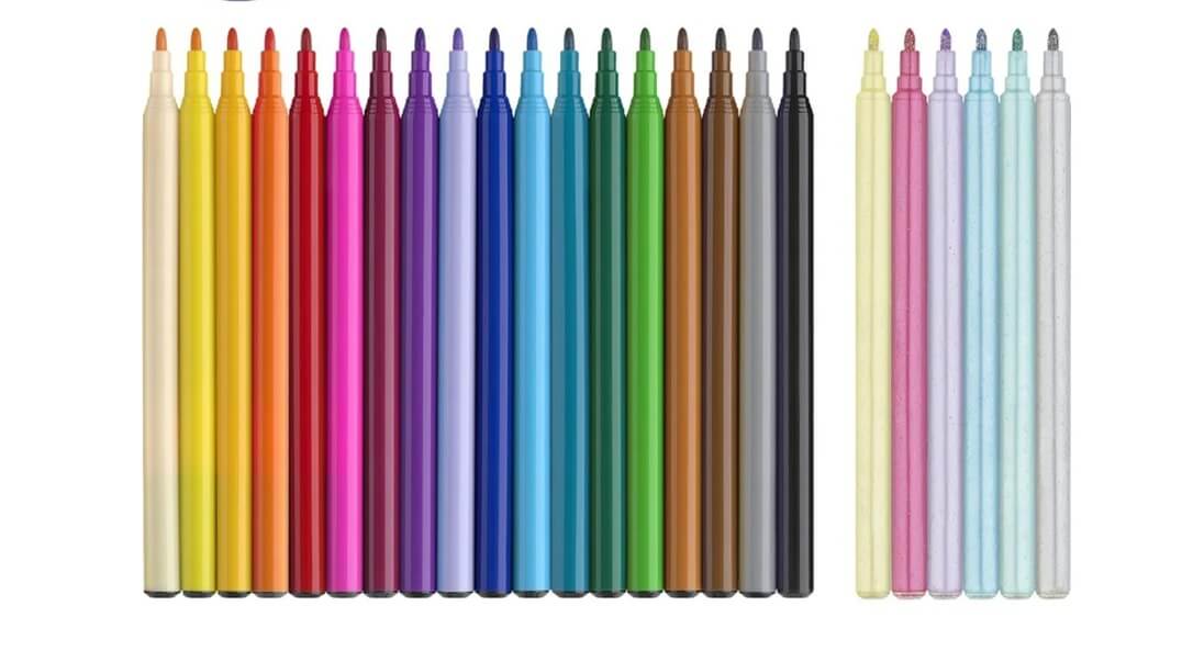 Faber-Castell Tusser 18 + 6 Pastel, Enhjørning – farverige tuscher og pastel glitretusser med enhjørningstema, arrangeret ved siden af æsken og dekoreret med små enhjørning-klistermærker.